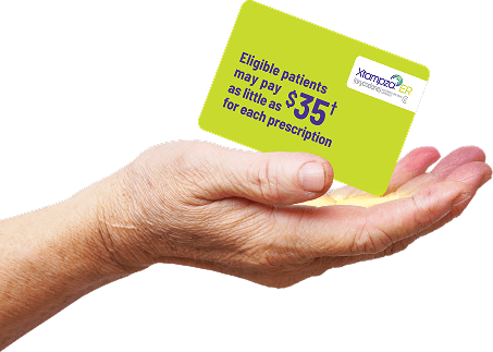A hand holding an XTAMPZA ER copay savings card.